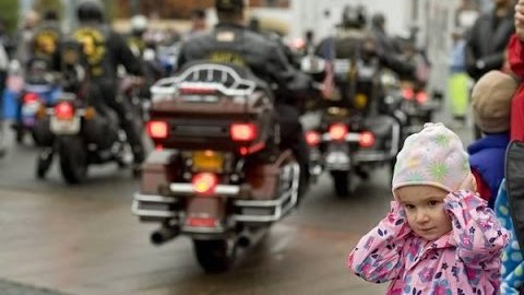 little-girl-holding-ears-at-biker-parade.jpg